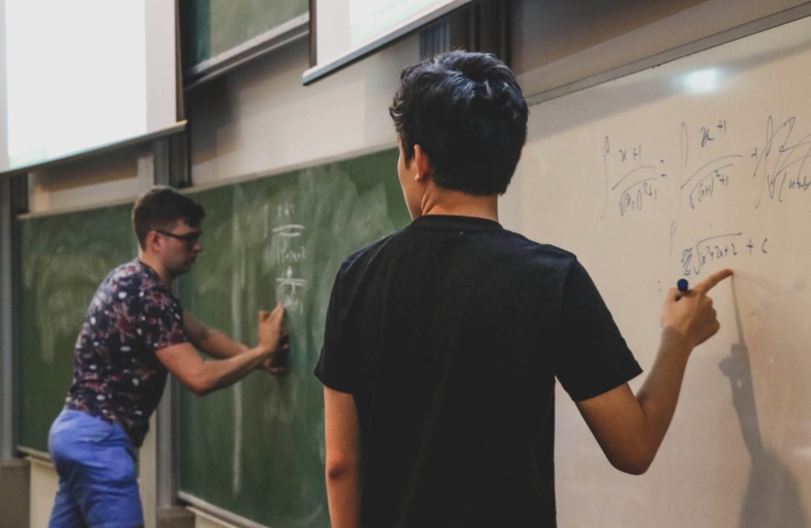 Students from UNSW Mathematics Society working out advanced maths problems