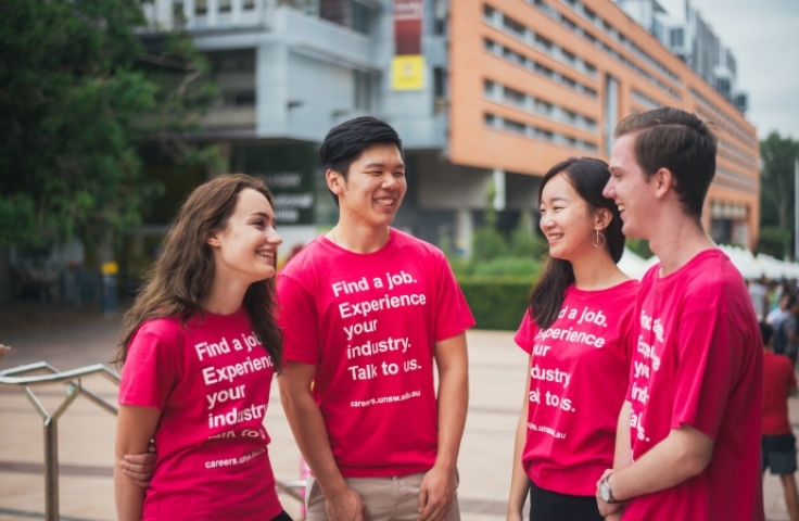 Four UNSW Students from Careers and Employment wearing pink branded t-shirts