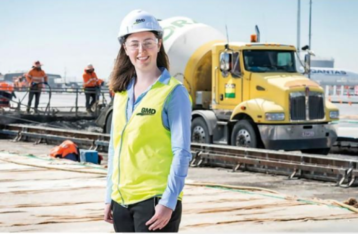 Woman in STEM working in the field outside a construction zone