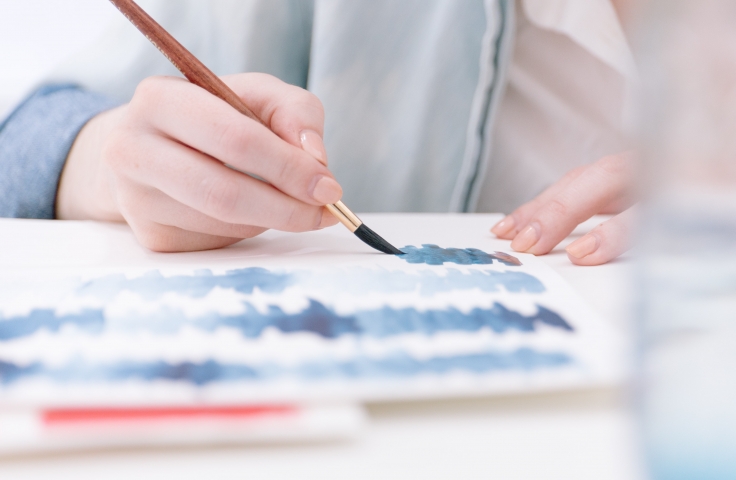 person painting blue colours